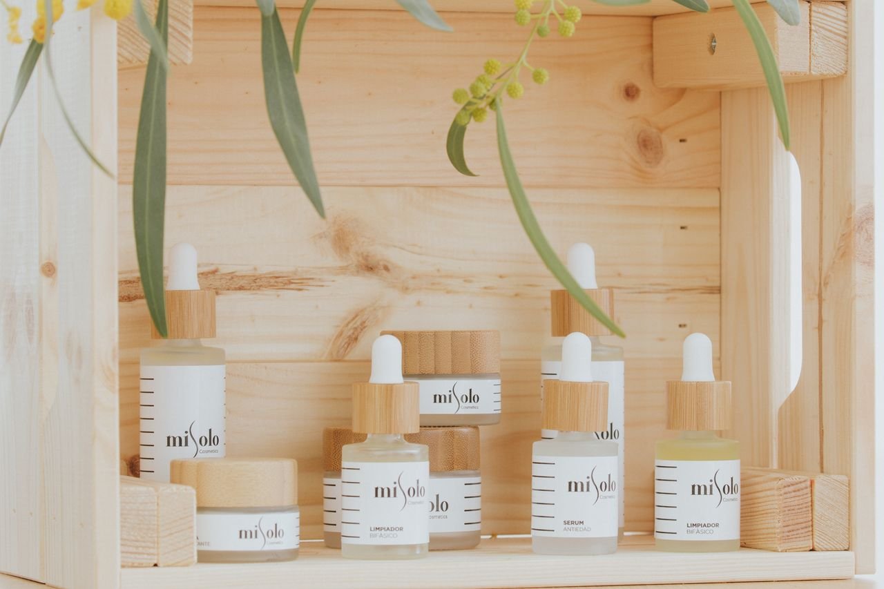 The Art of Drawing Readers In: Your attractive post title goes here Minimalist display of natural skincare products on a wooden shelf.